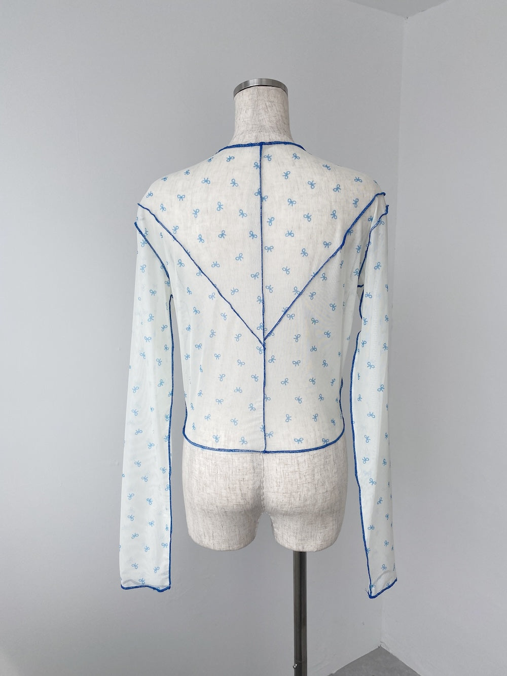 <SL2243601> パイピングリボンシアートップス